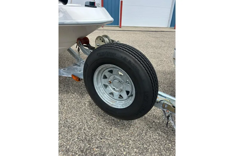 Slide: The Image of 1997 Wellcraft 160 Fisherman boat storage compartment, open and empty. - 18