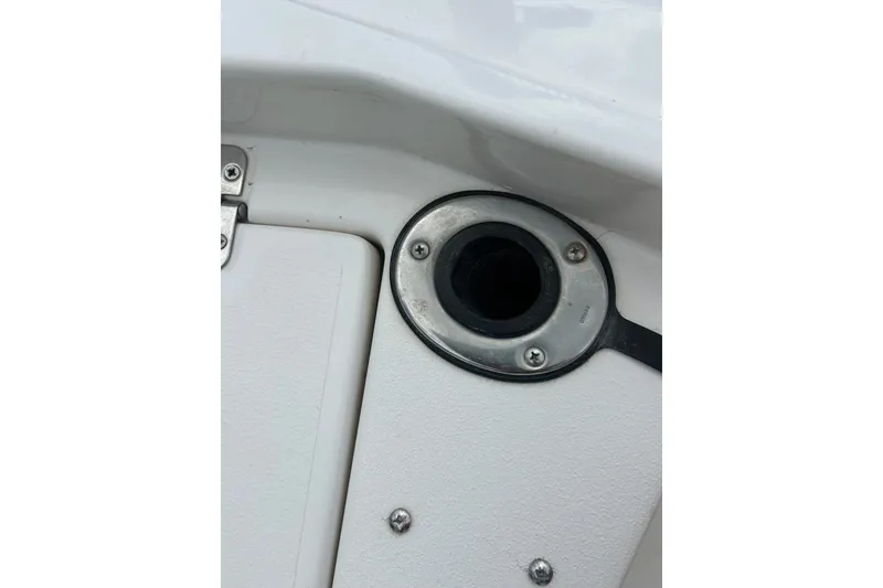 Slide: The Image of Open storage compartment on a 1997 Wellcraft 160 Fisherman boat. - 30