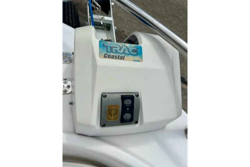 Slide: The Image of Trailer for 1997 Wellcraft 160 Fisherman with "EZ Loader" branding on pavement. - 4