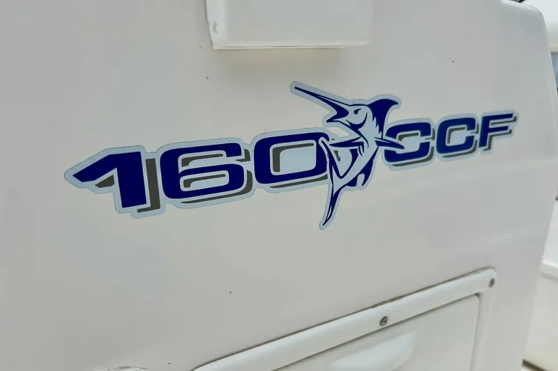 Slide: The Image of 1997 Wellcraft 160 Fisherman boat with West Marine cooler seat. - 7