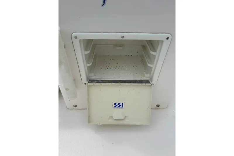 Slide: The Image of 1997 Wellcraft 160 Fisherman boat logo with marlin graphic on white surface. - 8