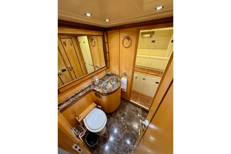 Slide: The Image of Luxurious bathroom in 2005 Mangusta 92 yacht with marble accents and modern fixtures. - 10