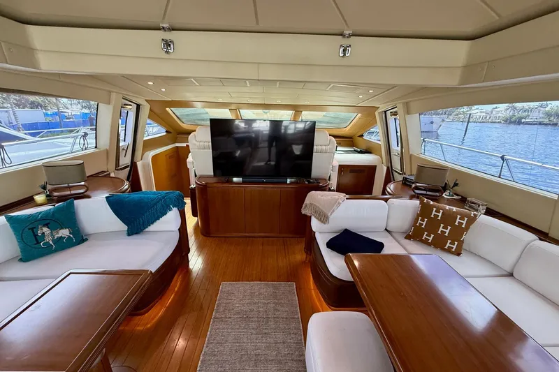 Slide: The Image of Luxurious interior of a 2005 Mangusta 92 yacht with elegant seating and large windows. - 4