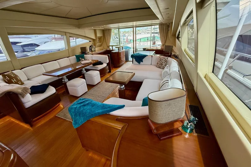 Slide: The Image of Luxurious interior of a 2005 Mangusta 92 yacht with elegant seating and wooden accents. - 5