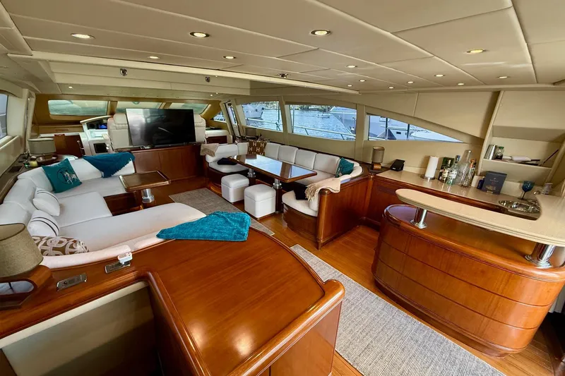 Slide: The Image of Luxurious interior of a 2005 Mangusta 92 yacht with elegant seating and modern amenities. - 8