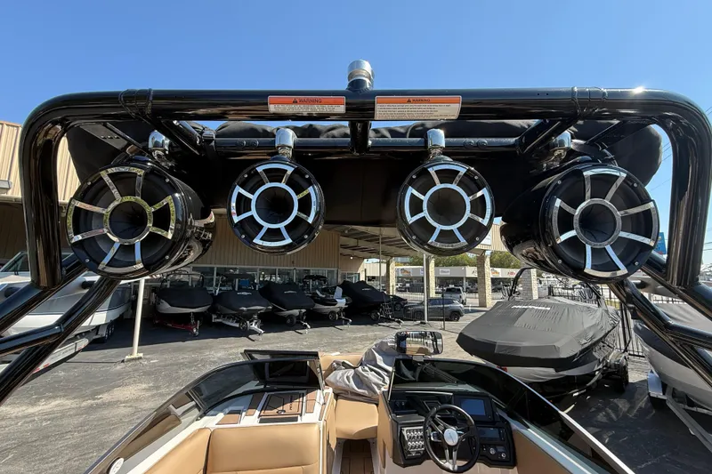 Slide: The Image of 2021 Moomba Max boat with tower speakers and sleek interior design. - 16