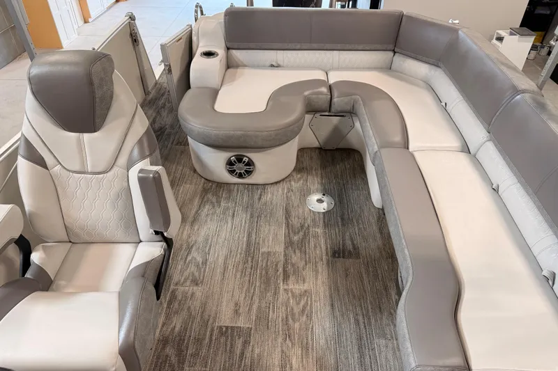 Slide: The Image of 2023 Avalon Catalina Platinum boat interior with luxurious seating and modern design. - 12