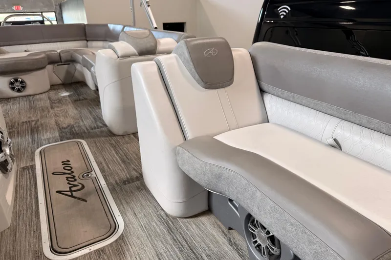 Slide: The Image of 2023 Avalon Catalina Platinum Rear J Lounge interior with elegant seating and wood-style flooring. - 6