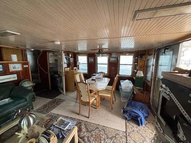 Slide: The Image of Interior of a 1991 Florida Bay Coasters 53 Trawler with dining area and cozy furnishings. - 15