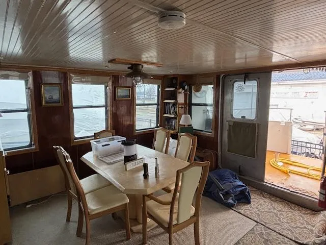 Slide: The Image of Interior of 1991 Florida Bay Coasters 53 Trawler with dining area and windows. - 2
