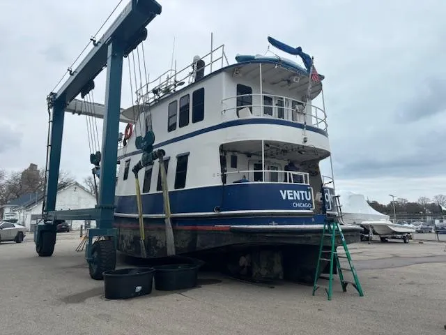 Slide: The Image of 1991 Florida Bay Coasters 53 Trawler on dry dock with maintenance equipment. - 6
