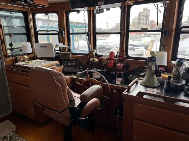 Slide: The Image of Interior of 1991 Florida Bay Coasters 53 Trawler with navigation equipment and captain's chair. - 8