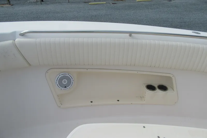Slide: The Image of 2012 Grady-White Canyon 271 boat interior with speaker and cup holders. - 12