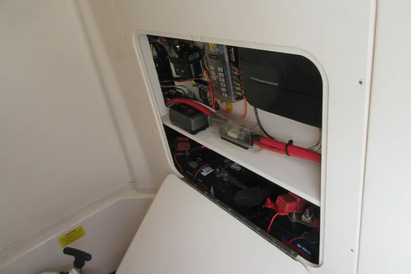 Slide: The Image of Electrical panel and wiring inside a 2012 Grady-White Canyon 271 boat. - 22