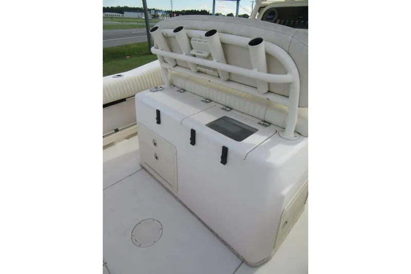 Slide: The Image of 2012 Grady-White Canyon 271 boat interior with rod holders and storage compartments. - 29