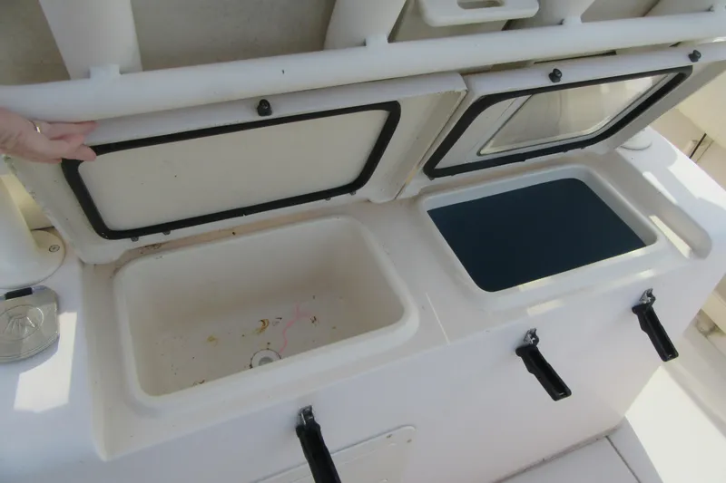 Slide: The Image of 2012 Grady-White Canyon 271 boat storage compartments, open and ready for use. - 31