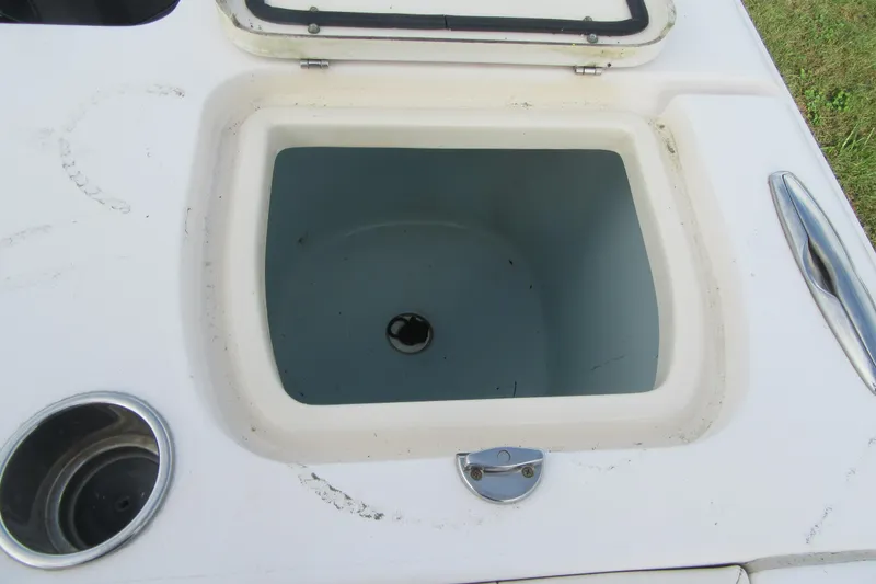 Slide: The Image of Open storage compartment on 2012 Grady-White Canyon 271 boat. - 32