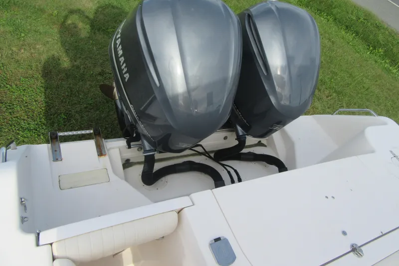 Slide: The Image of 2012 Grady-White Canyon 271 boat with dual Yamaha outboard engines. - 34