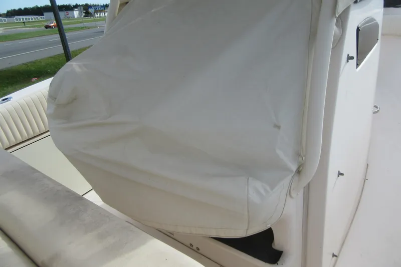 Slide: The Image of 2012 Grady-White Canyon 271 boat interior with covered seating area. - 36