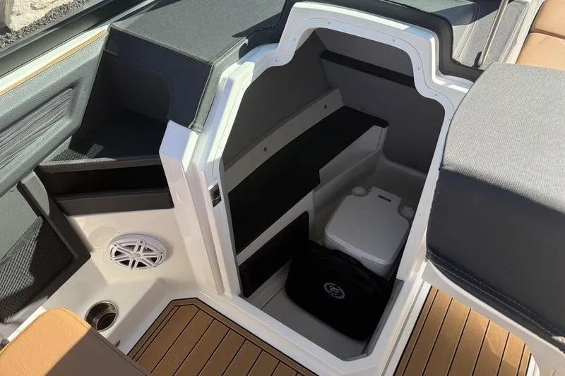 Slide: The Image of 2022 Cobalt R6 boat interior with storage compartment and speaker. - 13