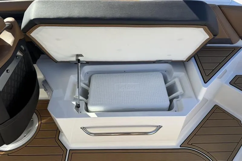 Slide: The Image of Open storage compartment with cooler on 2022 Cobalt R6 boat deck. - 18