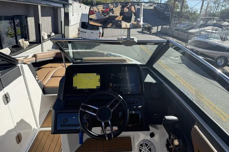 Slide: The Image of 2022 Cobalt R6 boat dashboard with steering wheel and navigation display. - 21