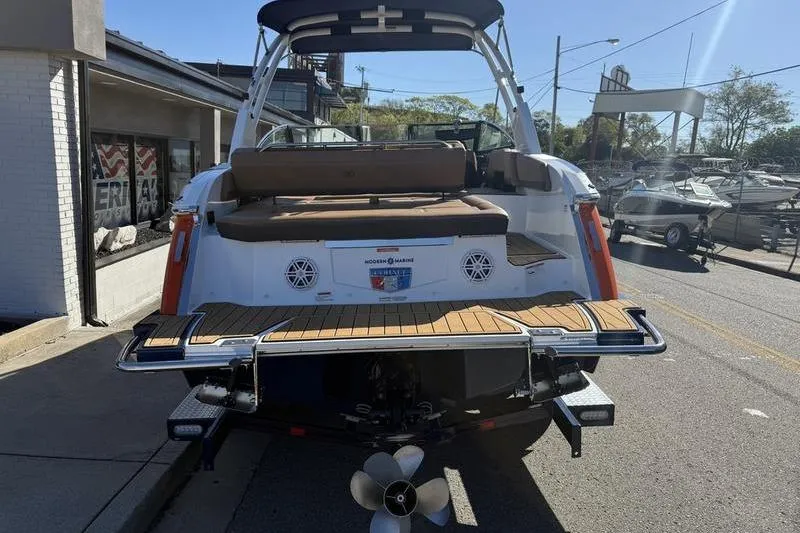 Slide: The Image of 2022 Cobalt R6 boat with teak swim platform and seating, displayed outdoors. - 33