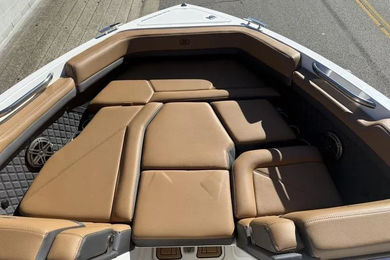 Slide: The Image of 2022 Cobalt R6 boat interior with tan cushioned seating and sleek design. - 8