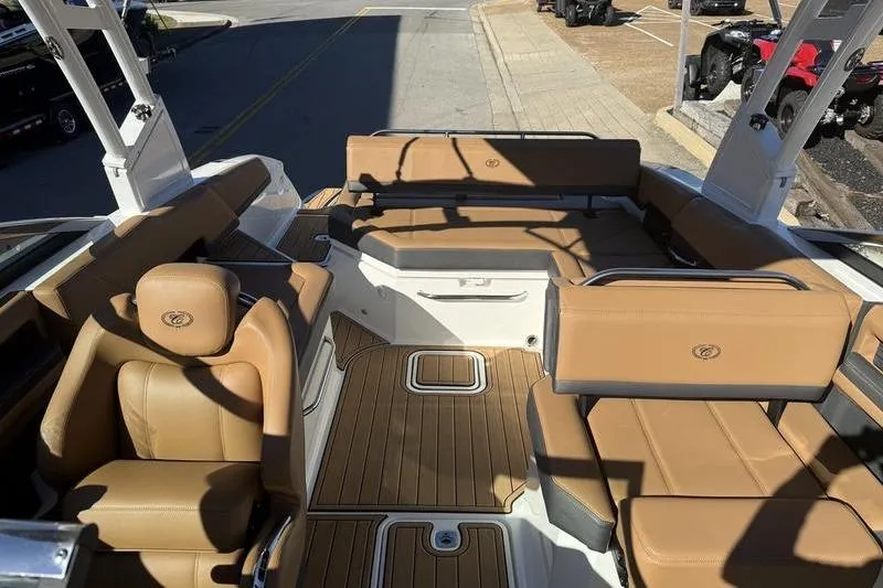 Slide: The Image of Luxurious interior of 2022 Cobalt R6 boat with tan leather seating and wood flooring. - 9