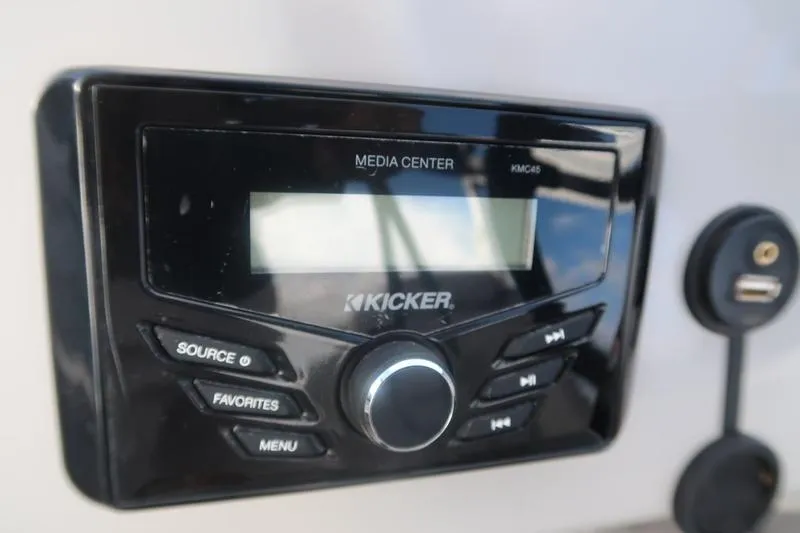 Slide: The Image of Kicker media center in 2020 Bennington 20 SLMX boat, featuring control buttons and USB port. - 15