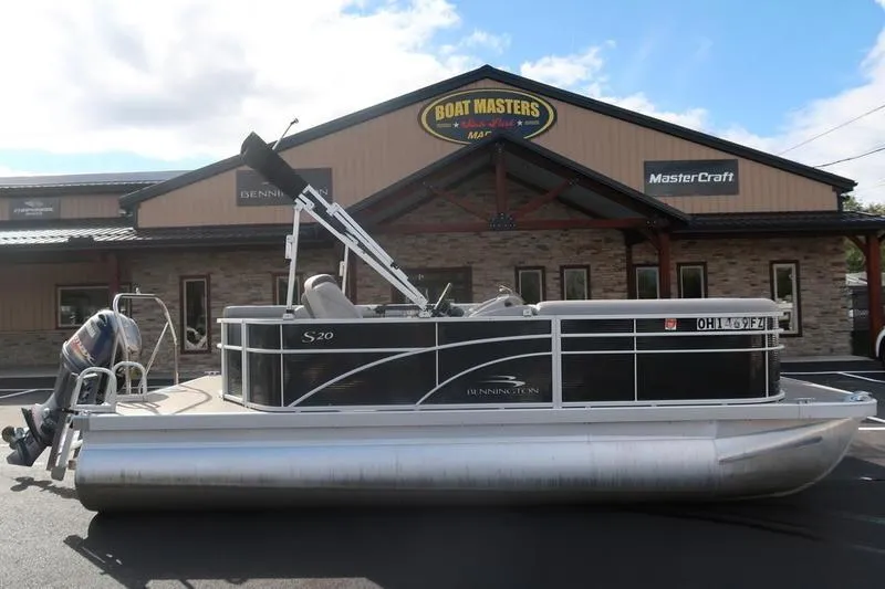 The Image of 2020 Bennington 20 SLMX pontoon boat parked outside Boat Masters dealership. - 2