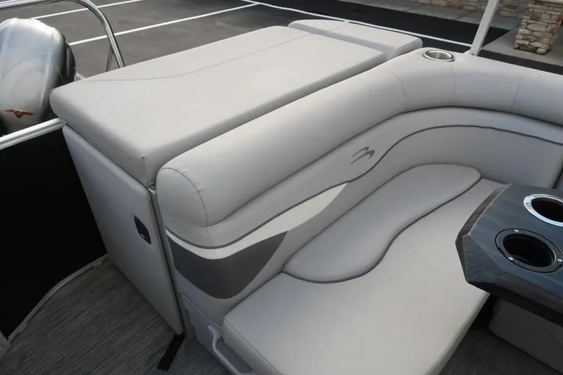 Slide: The Image of 2020 Bennington 20 SLMX boat interior with plush seating and cup holders. - 21