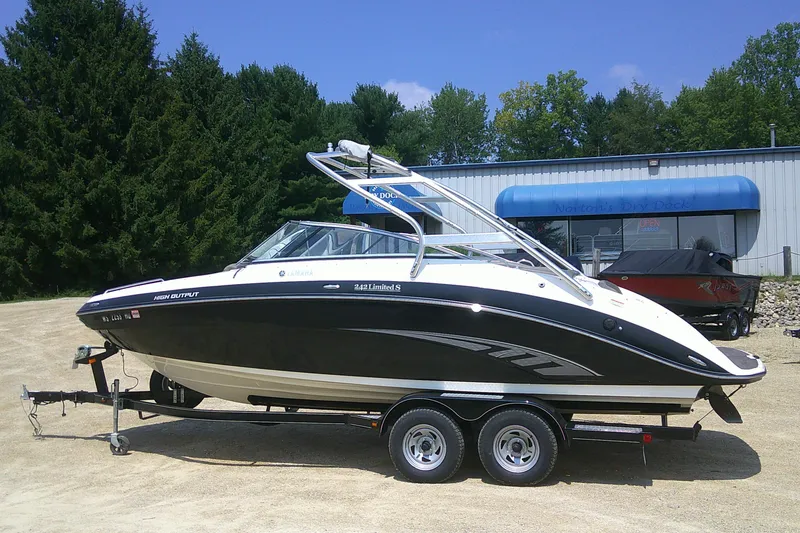Slide: The Image of 2010 Yamaha Boats 242 Limited S on trailer, parked outdoors. - 1