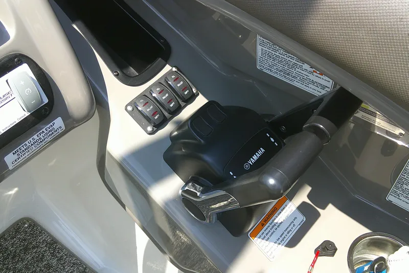 Slide: The Image of Control panel of 2010 Yamaha Boats 242 Limited S with throttle and switches. - 10