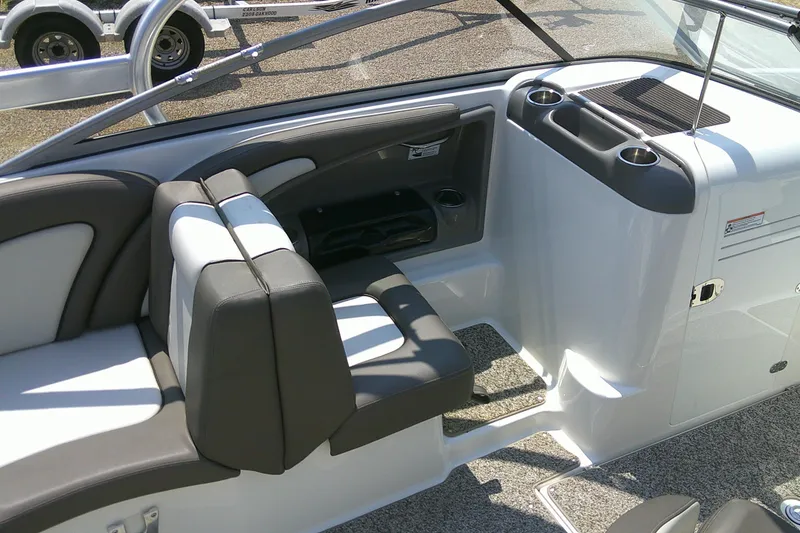 Slide: The Image of Interior of 2010 Yamaha Boats 242 Limited S, featuring seating and cup holders. - 19