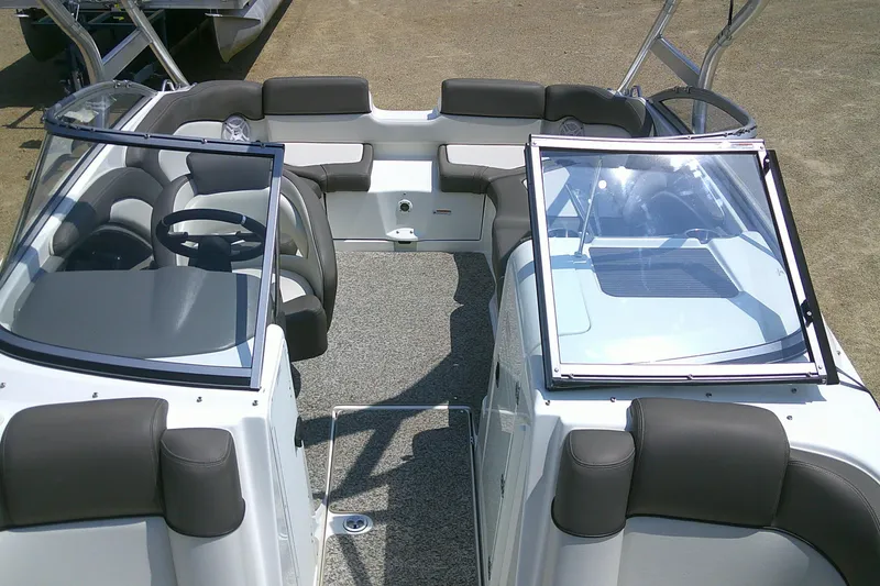 Slide: The Image of 2010 Yamaha Boats 242 Limited S interior with seating and steering wheel. - 5