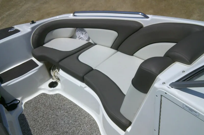 Slide: The Image of 2010 Yamaha Boats 242 Limited S interior seating with gray and white upholstery. - 6
