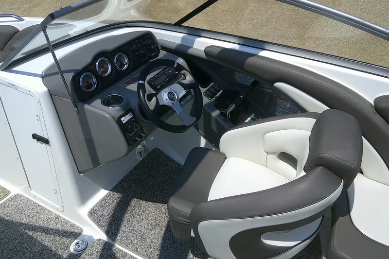 Slide: The Image of 2010 Yamaha Boats 242 Limited S cockpit with steering wheel and control panel. - 9