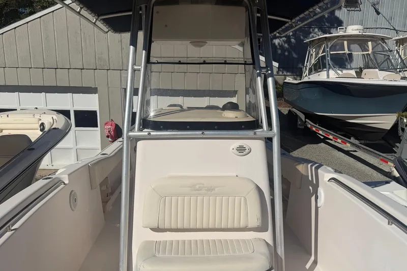 Slide: The Image of 2005 Grady-White Advance 257 boat with cushioned seating area. - 2