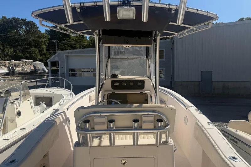 Slide: The Image of 2005 Grady-White Advance 257 boat console with steering wheel and navigation equipment. - 4