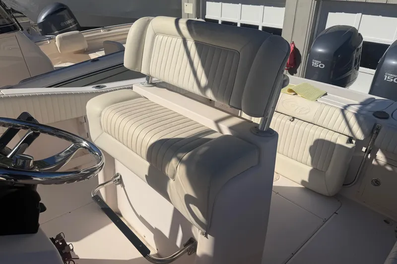 Slide: The Image of 2005 Grady-White Advance 257 boat console with steering wheel and navigation system. - 7