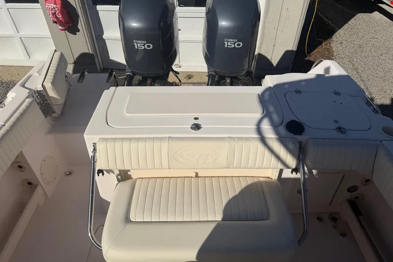Slide: The Image of 2005 Grady-White Advance 257 boat interior with rod holders and storage compartments. - 9