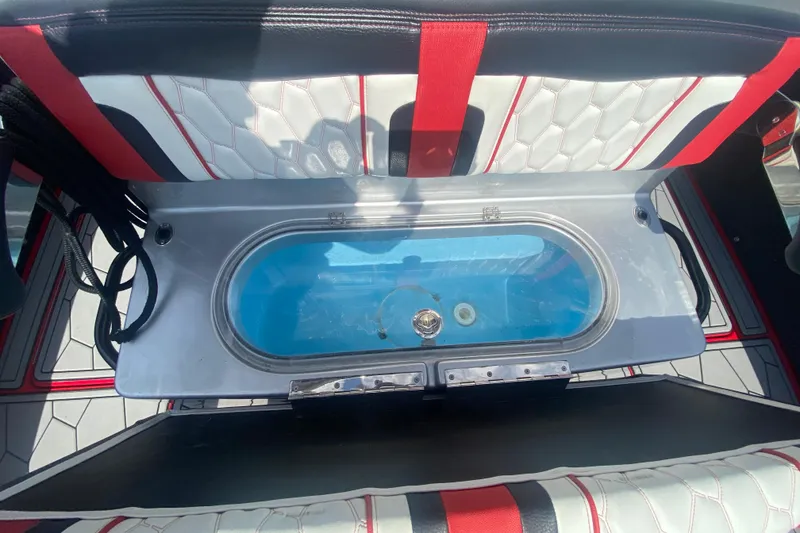Slide: The Image of 2021 Fountain 34 SC boat interior with livewell and stylish seating. - 13
