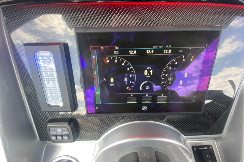 Slide: The Image of Dashboard of 2021 Fountain 34 SC boat with digital display and controls. - 21