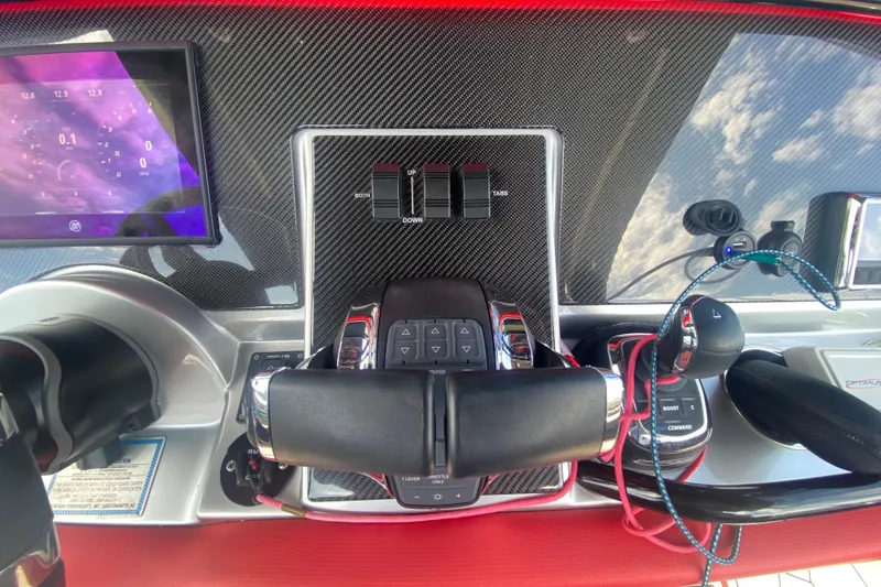 Slide: The Image of Control panel of 2021 Fountain 34 SC boat with carbon fiber finish and digital display. - 22