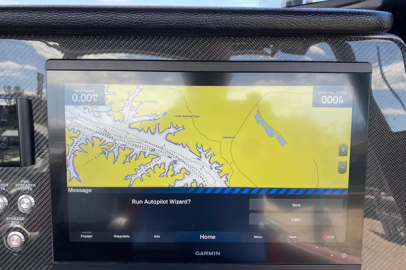 Slide: The Image of Garmin navigation display on 2021 Fountain 34 SC boat, showing map and autopilot options. - 27
