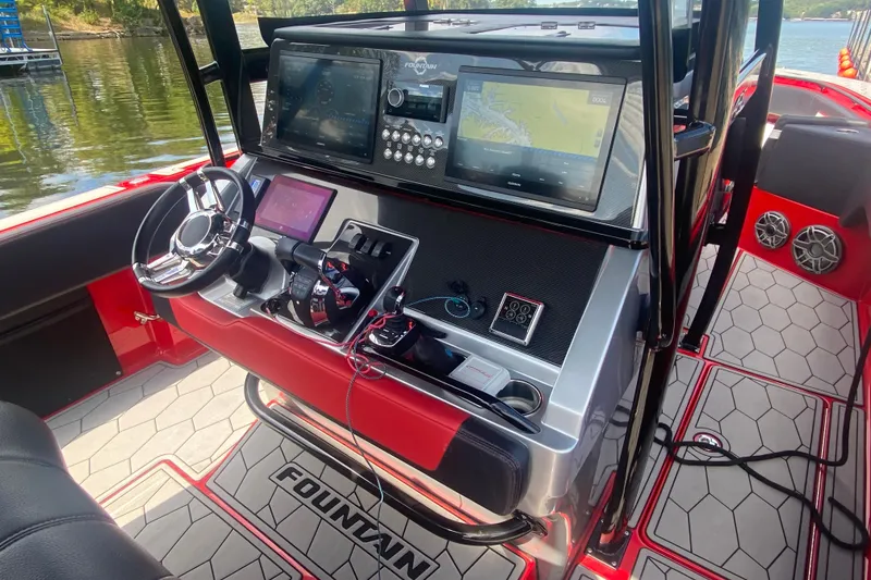 Slide: The Image of 2021 Fountain 34 SC boat dashboard with advanced navigation and control systems. - 29