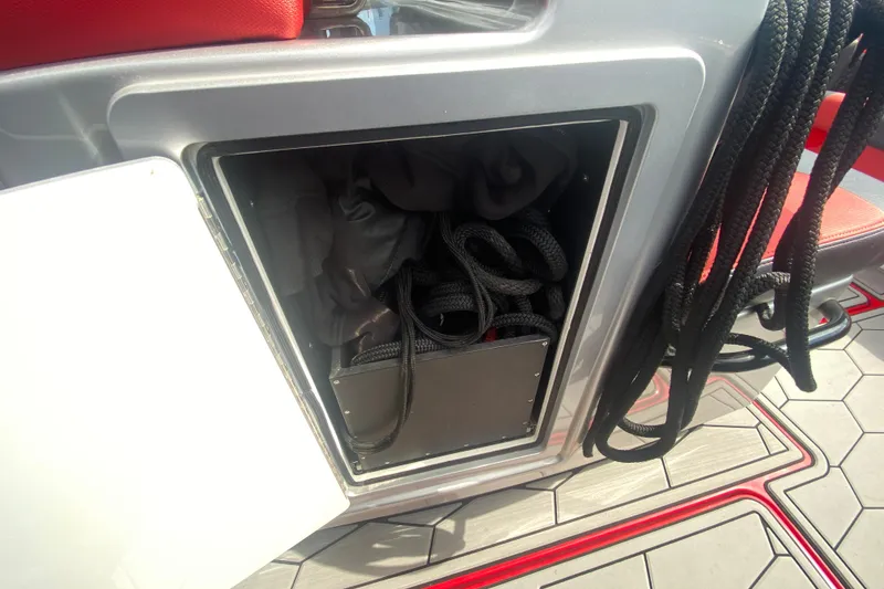 Slide: The Image of Storage compartment with ropes on a 2021 Fountain 34 SC boat. - 41