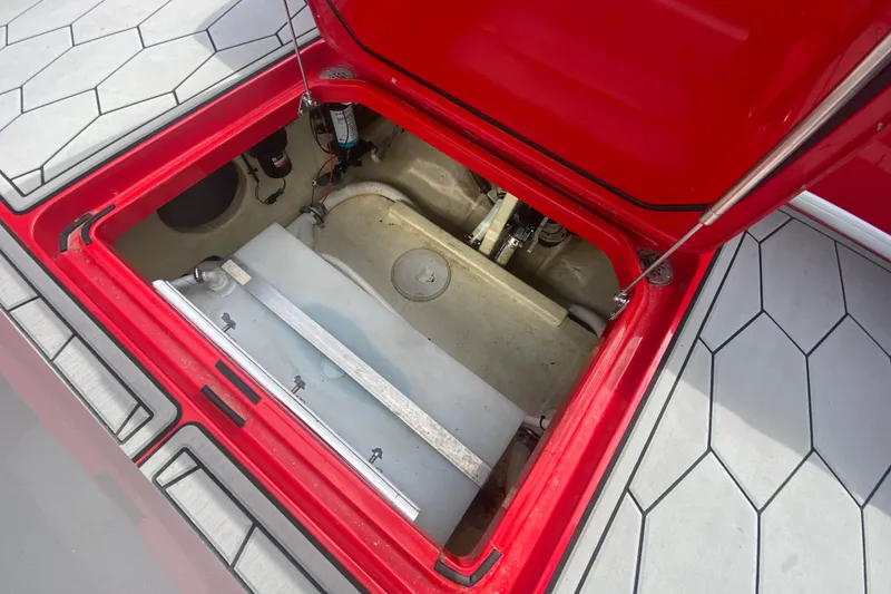 Slide: The Image of Open hatch of 2021 Fountain 34 SC boat showing internal components. - 43