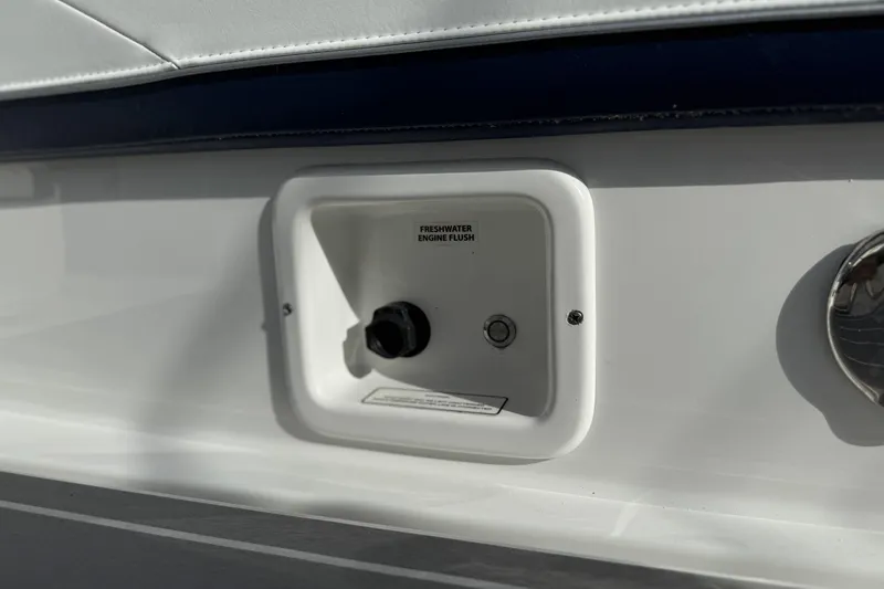 Slide: The Image of Freshwater engine flush on 2021 Formula 330 Crossover Bowrider OB boat. - 17